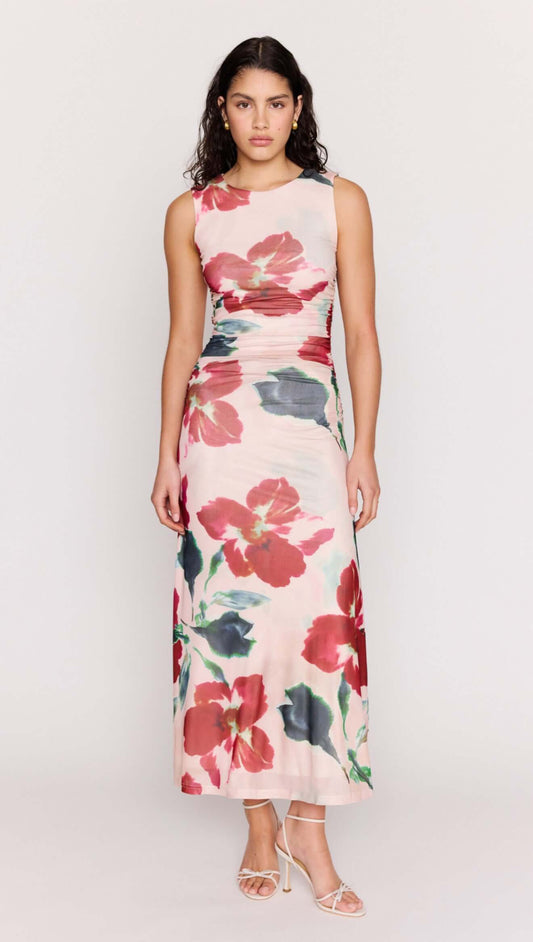 Pink Floral Mesh Midi Dress worn by a model, featuring vibrant floral patterns and a body-skimming silhouette.
