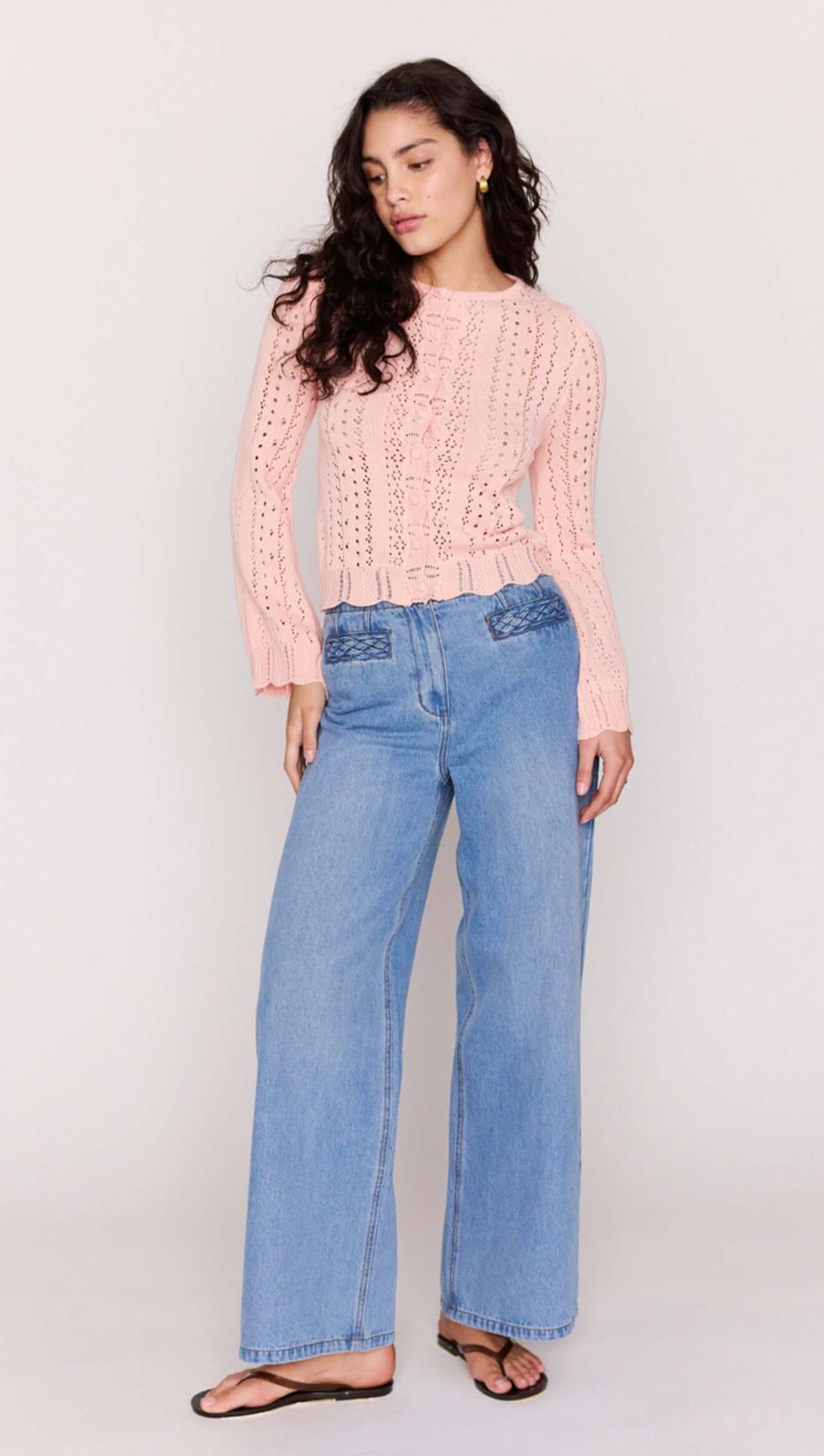 Soft Pink Cotton Pointelle Cardigan styled with high-waisted blue jeans and sandals on a model.
