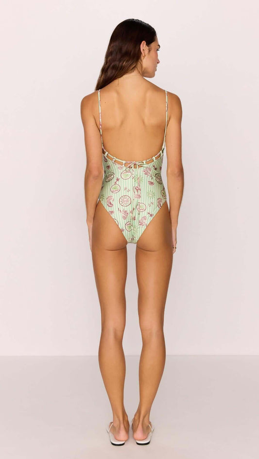 Back view of the Green Stripe Printed Low-Back One Piece Swimsuit with shell and sea motif print by MINKPINK.