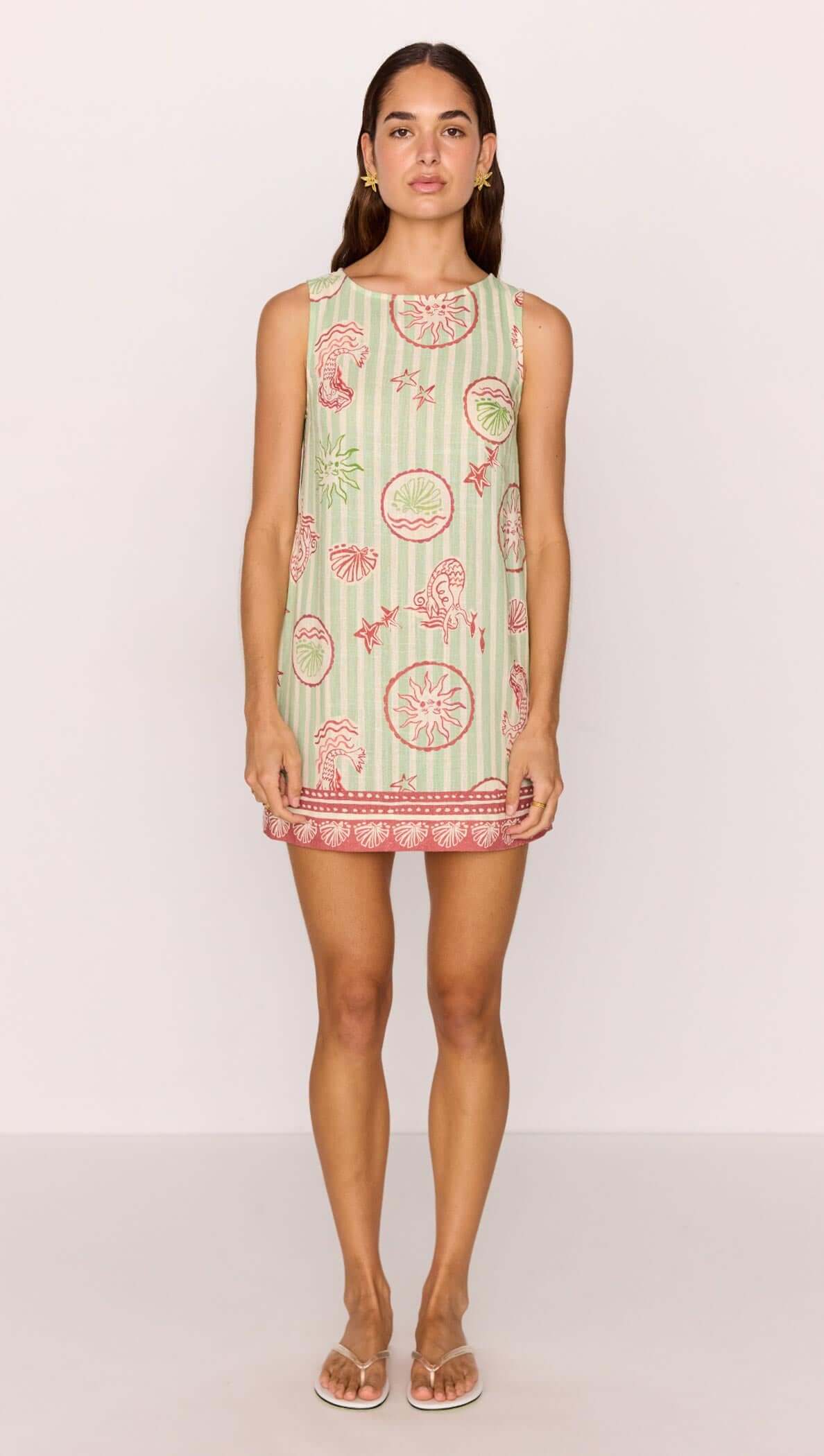 Linen Blend Green Stripe Printed Shift Mini Dress worn by a model, featuring coastal motifs and a relaxed silhouette.