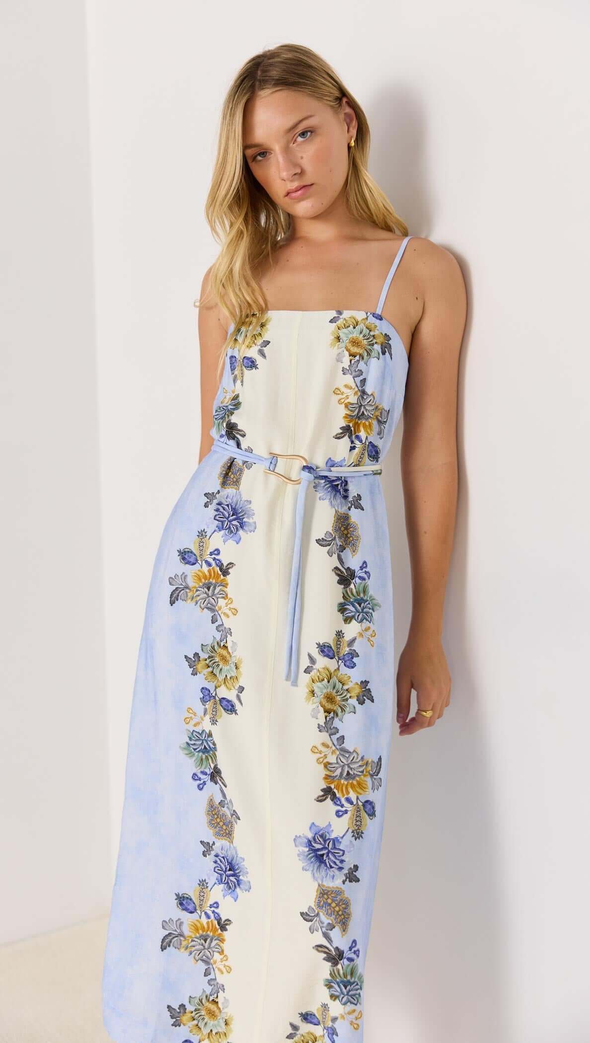 Lucia blue floral midi dress with tie waist, featuring a square neckline and spaghetti straps, perfect for sunny days.