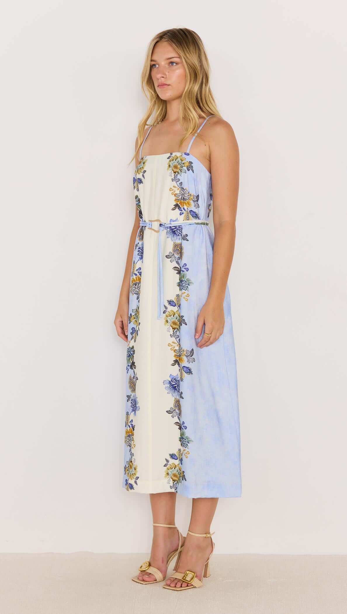 Lucia blue floral midi dress with tie waist, featuring slim straps and vibrant floral prints, perfect for summer occasions.