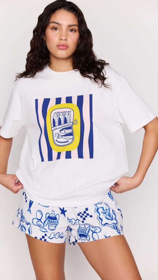 Woman wearing Statement Relaxed Oversized Cotton Tee with Mediterranean print and stylish shorts.
