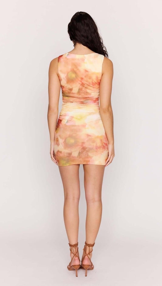 Back view of the Sunset Tonal Mesh Mini Dress with watercolor-inspired print and subtle ruching.