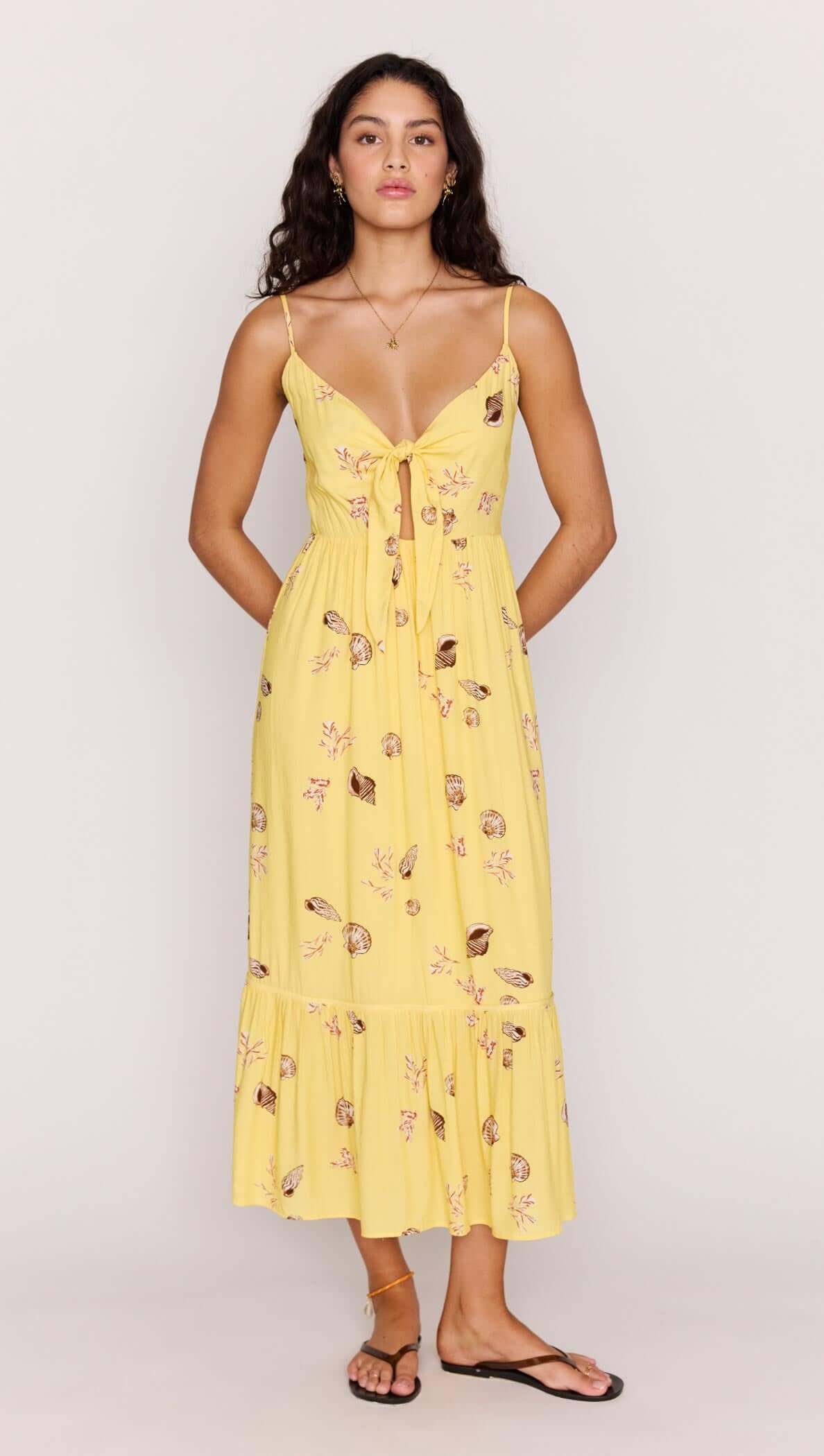 Yellow Printed ECOVERO Summer Midi Dress featuring a front tie, V-neckline, and a flowing skirt in a seashell print.