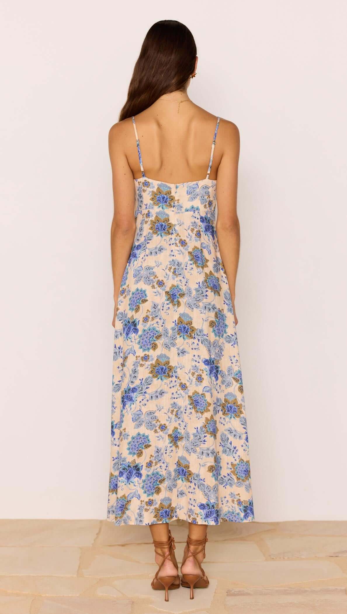 Linen Blend Blue Floral Bias Midi Dress back view showing adjustable straps and floral print details.