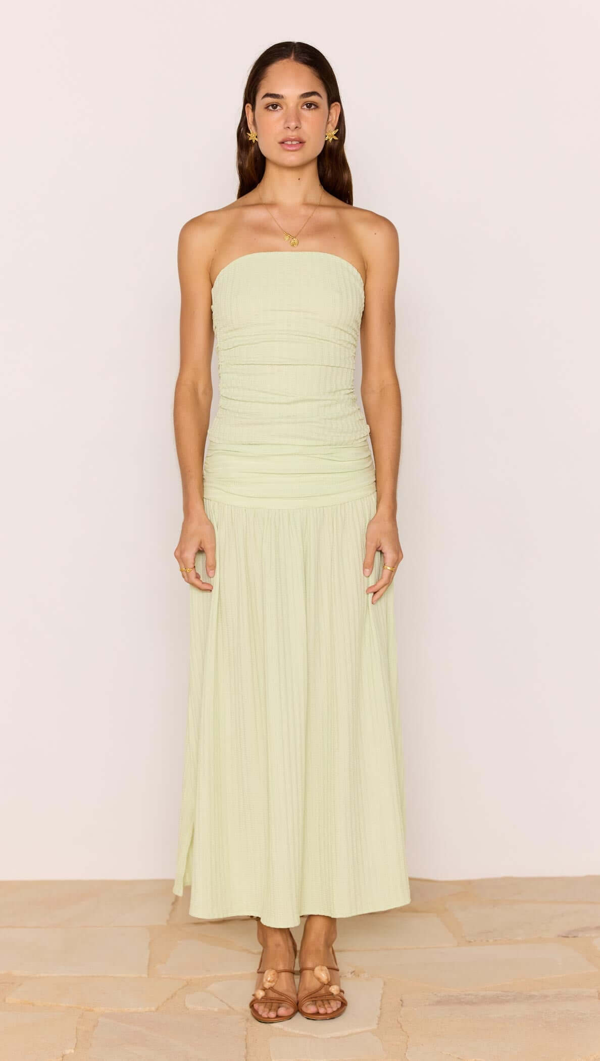 Pistachio Side Split Maxi Skirt styled with a matching strapless top on a model.
