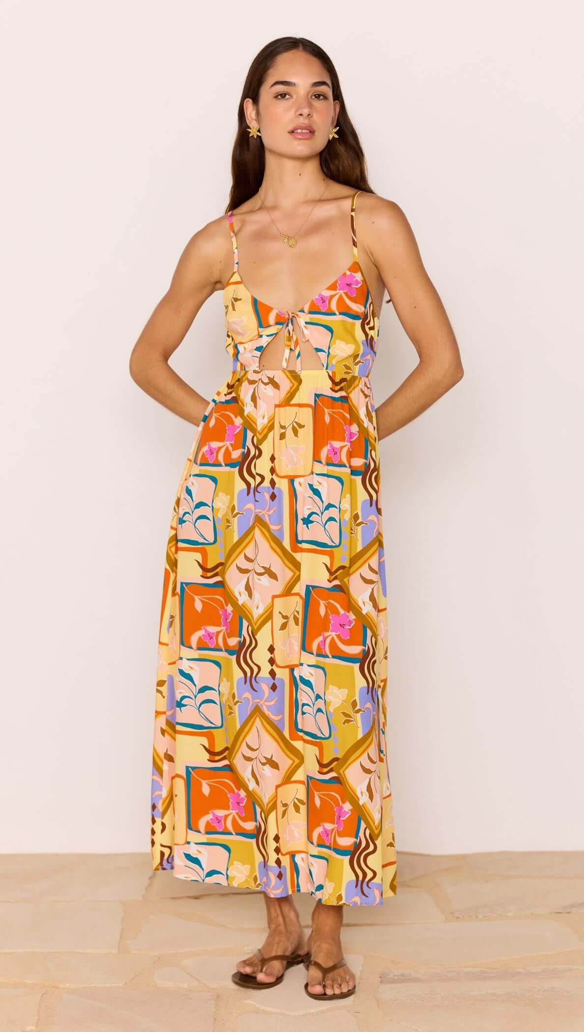 Bold Scarf Print Midi Dress With Cut Out worn by a model showcasing its vibrant abstract floral design.