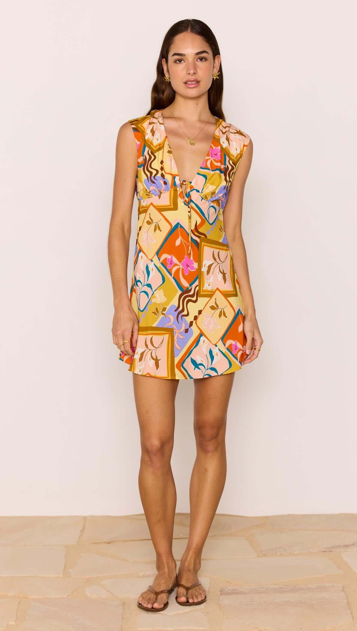 Bold Scarf Print Mini Dress in vibrant colors with plunging neckline and playful design, perfect for summer.