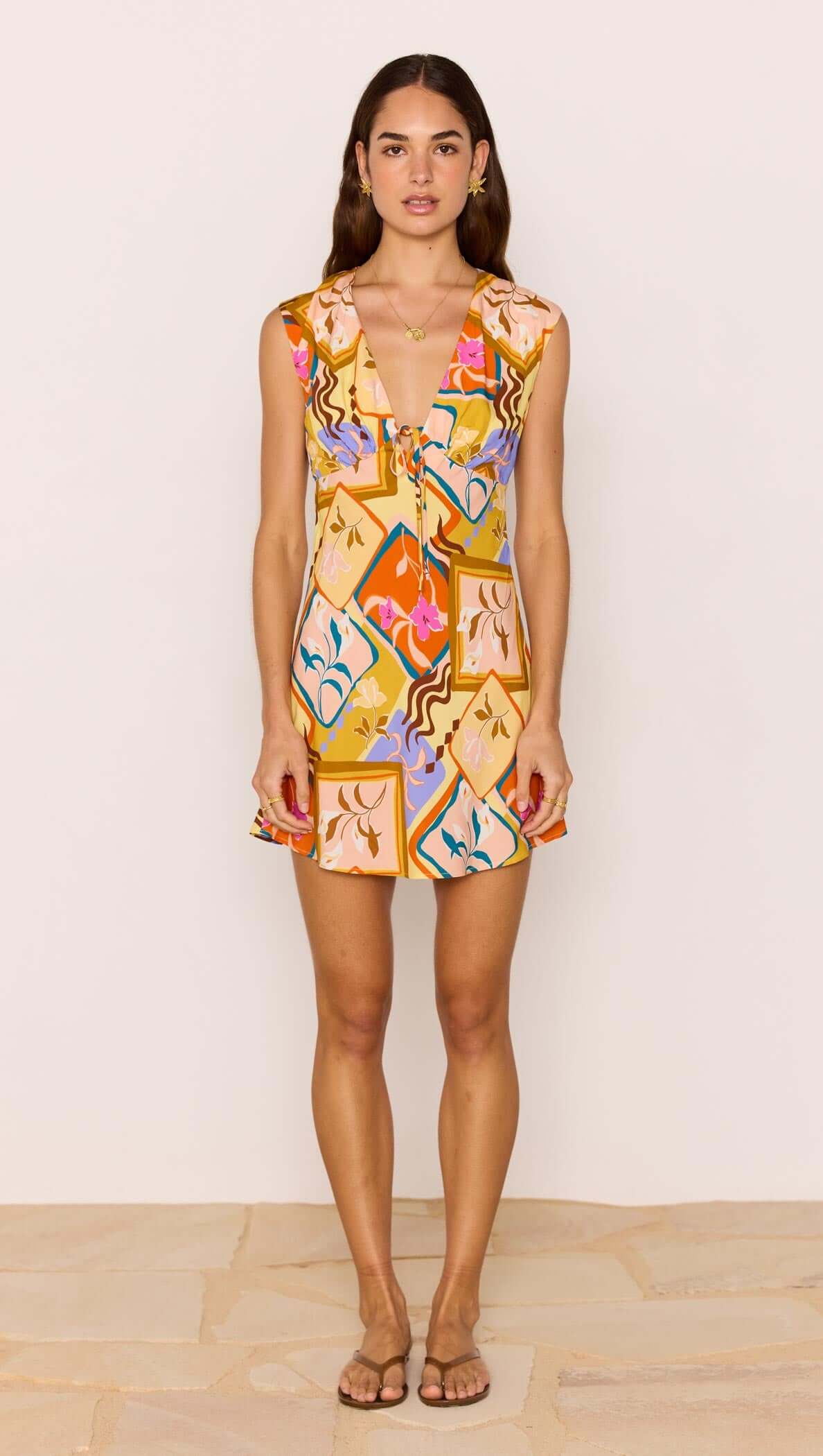 Bold Scarf Print Mini Dress worn by a model, showcasing its vibrant print and flattering mini silhouette.