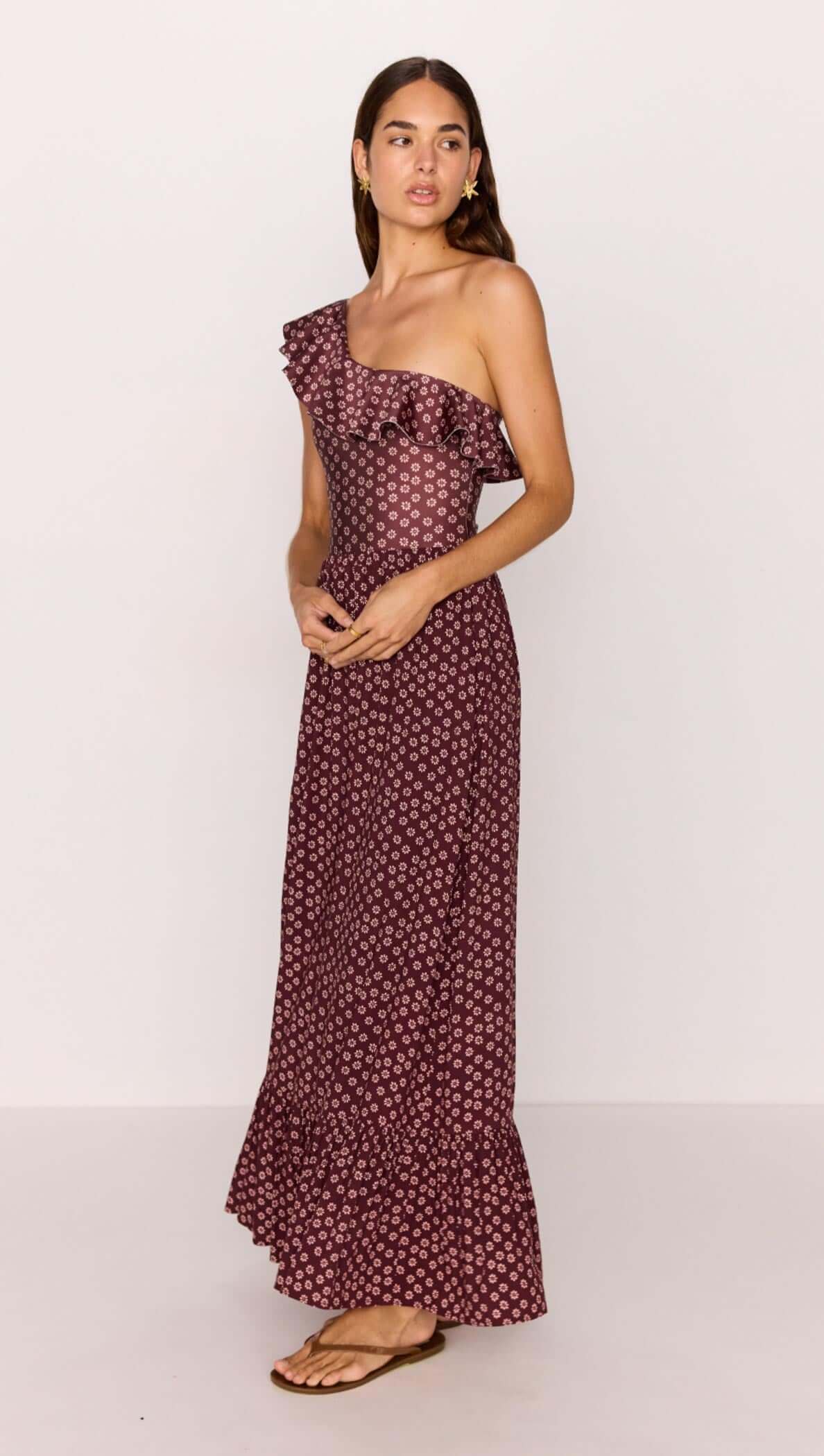 Sierra Ruffle Hem Maxi Skirt in Burgundy Floral Print showcased on a model, highlighting its stylish design.