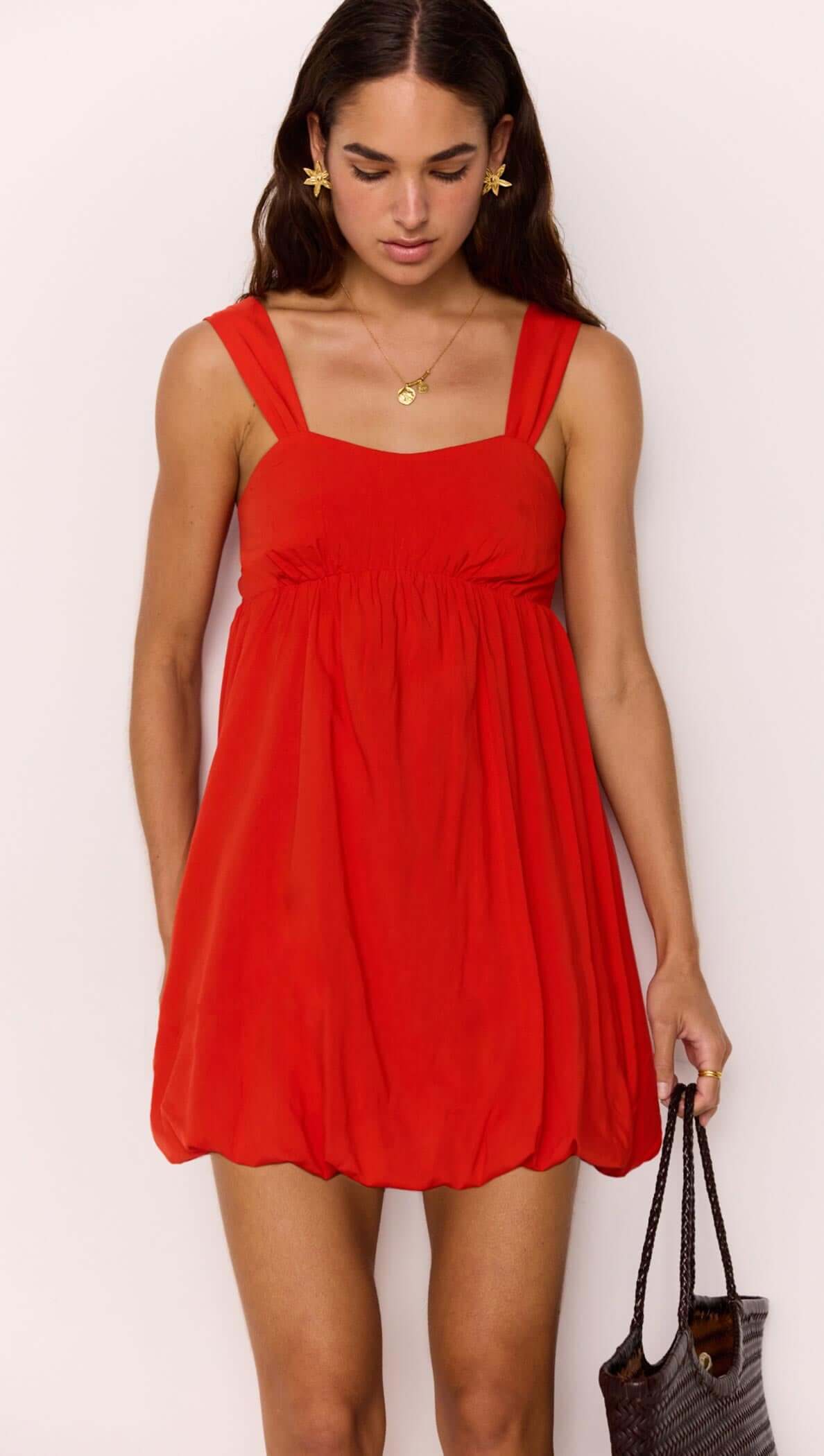 Scarlett Red Bubble Mini Dress with a soft bubble hem and gathered bust, creating a flirty summer silhouette.