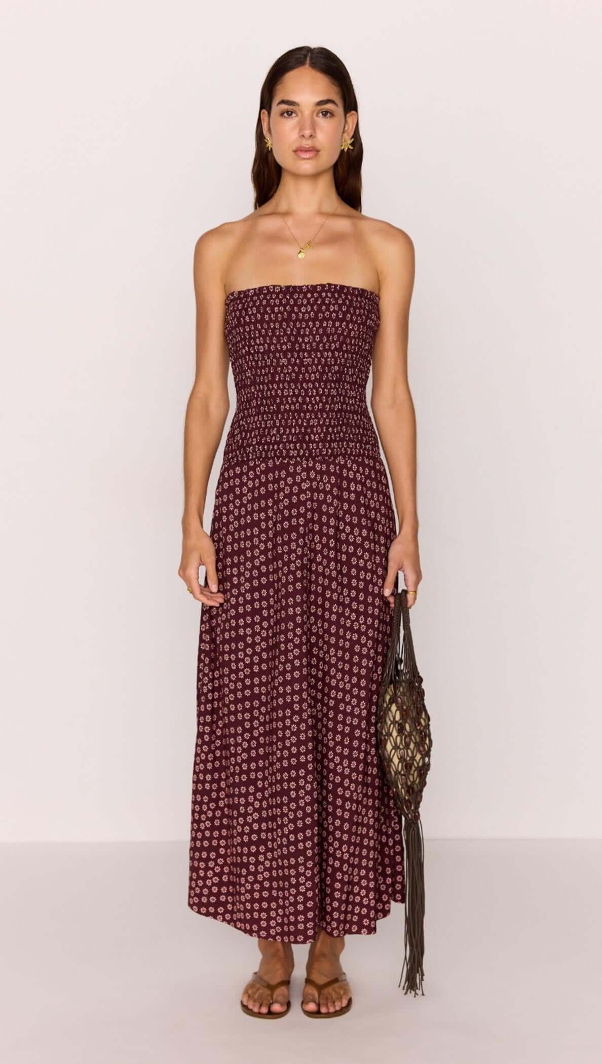 Burgundy floral print maxi dress with a strapless ruched bodice, perfect for summer outings and casual occasions.