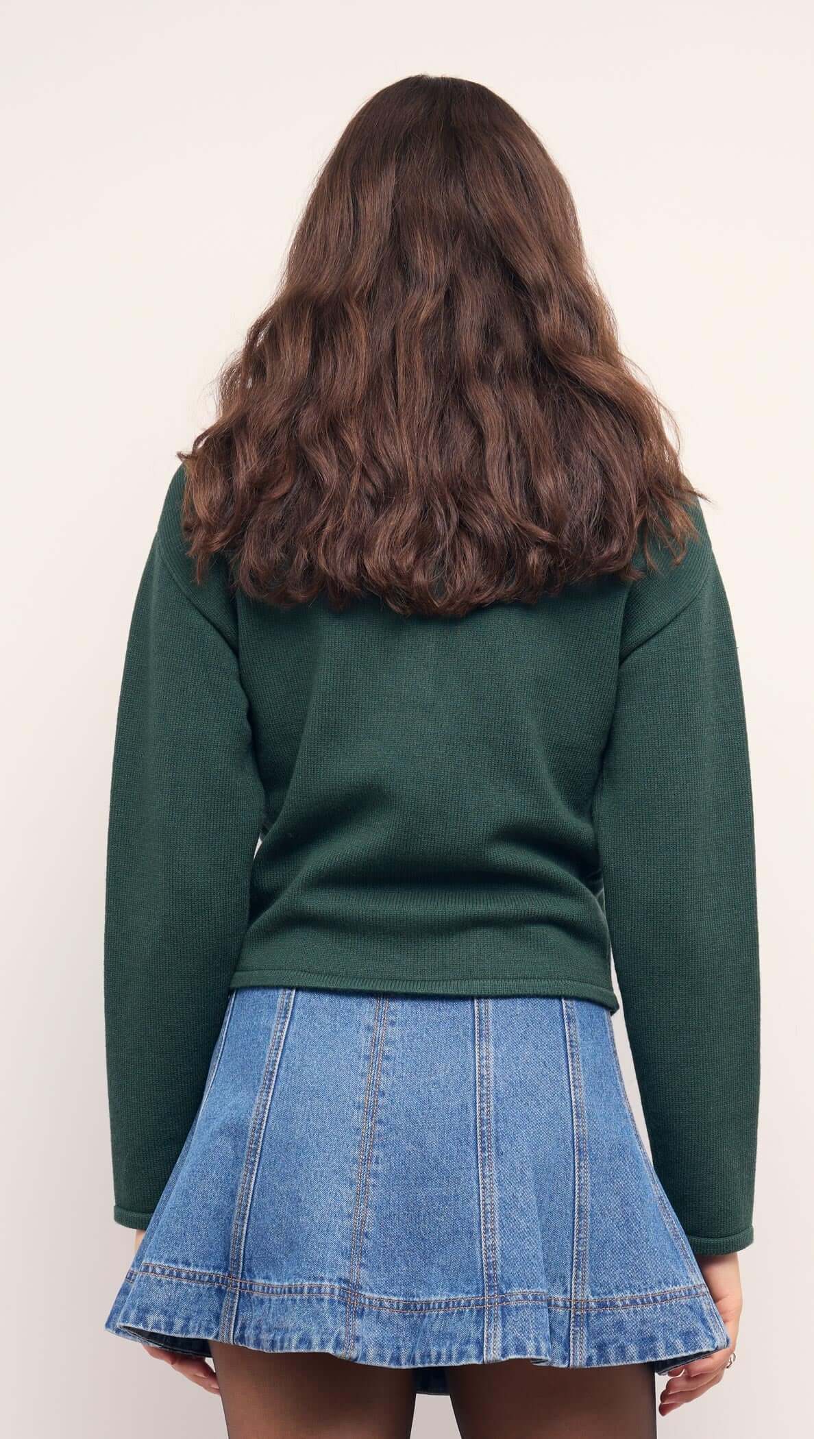 Teal Green Knit Polo Sweater showcased with a denim mini skirt from the back, emphasizing casual chic style.