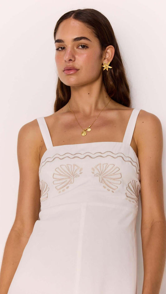 White Midi Dress with Embroidered Shell Detail showcasing delicate shell embroidery and a fitted bodice.