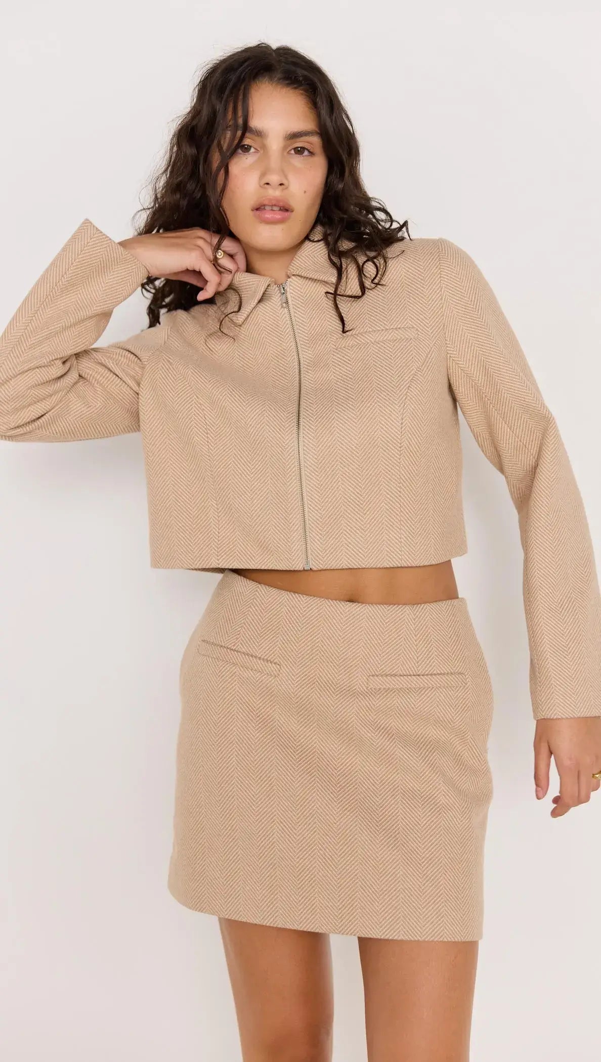 Audrey Herringbone Mini Skirt paired with matching cropped jacket in soft brown herringbone fabric.