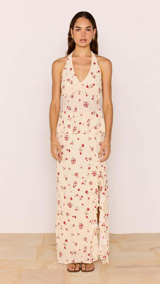 Model wearing a Red & Cream Floral Halter Bias Top with a matching skirt, showcasing a vintage floral print.