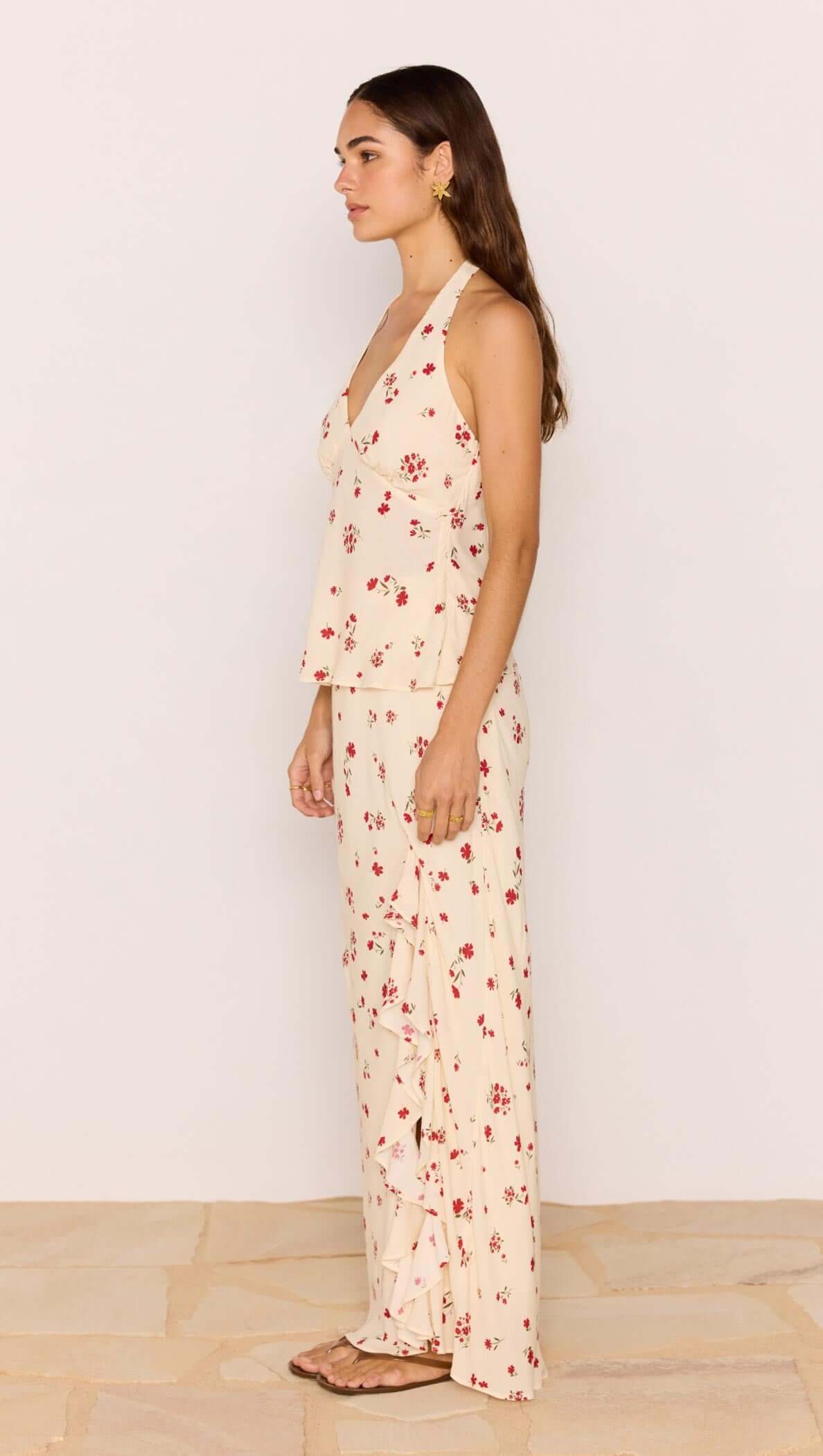 Model wearing Red & Cream Floral Ruffle Bias Maxi Skirt paired with a floral top, showcasing summer fashion.