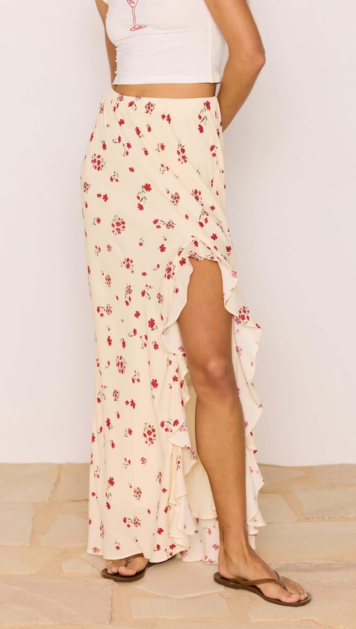 Red & Cream Floral Ruffle Bias Maxi Skirt showcasing a flowing design and feminine ruffle hem.