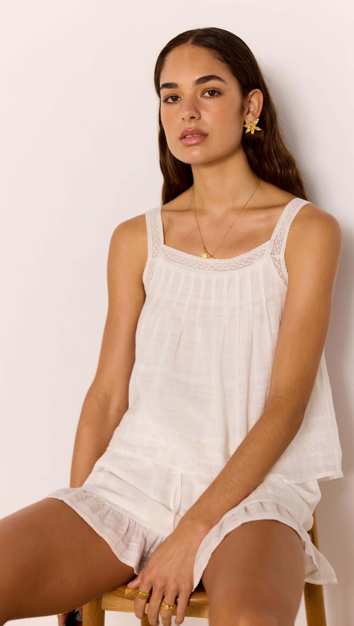 Lace Detail White Cotton Top model wearing a relaxed fit summer top with lace trim and soft viscose lining.