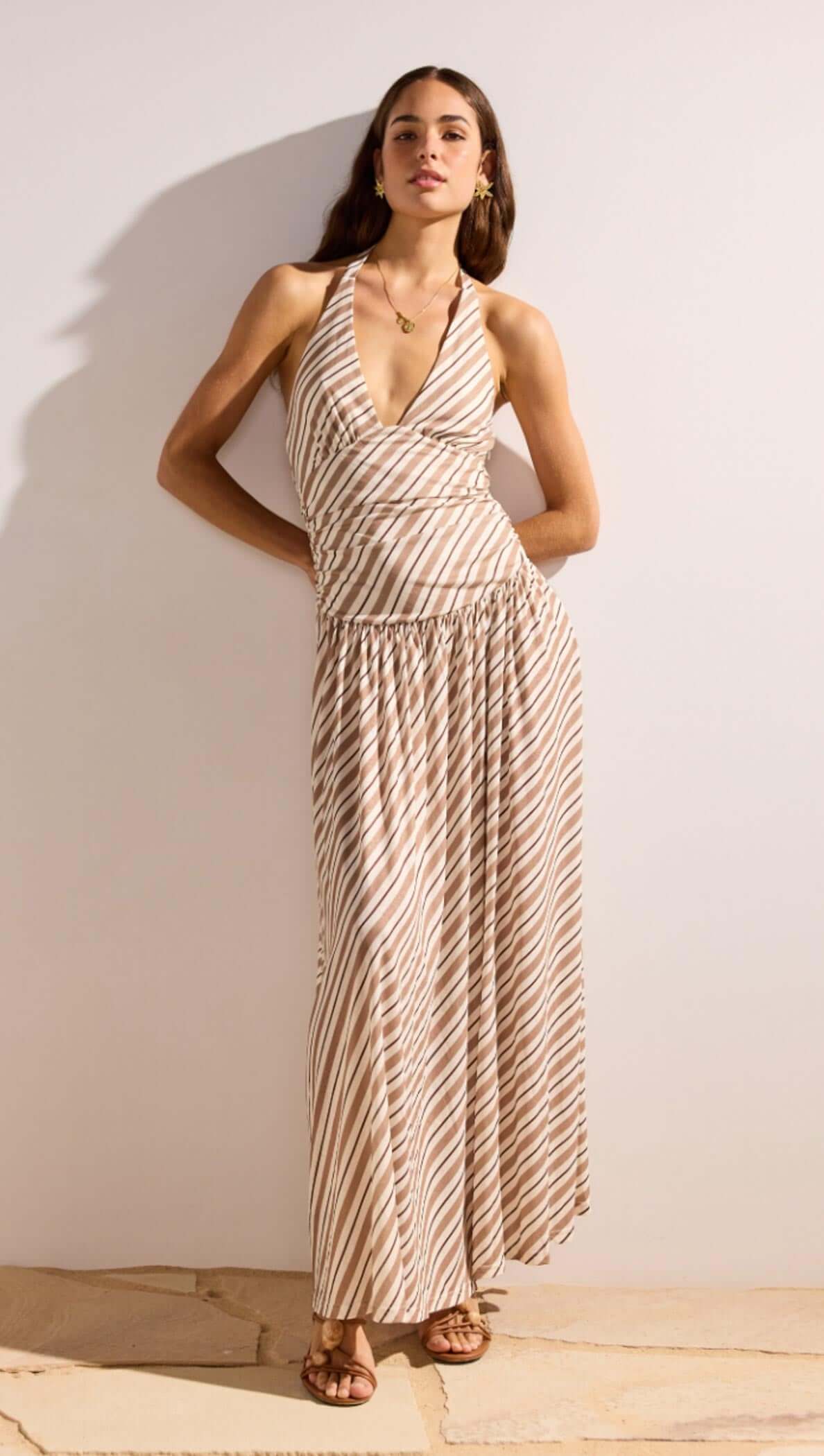 Brown & Cream Stripe Low-Waist Halter Maxi Dress styled on a model against a neutral background.