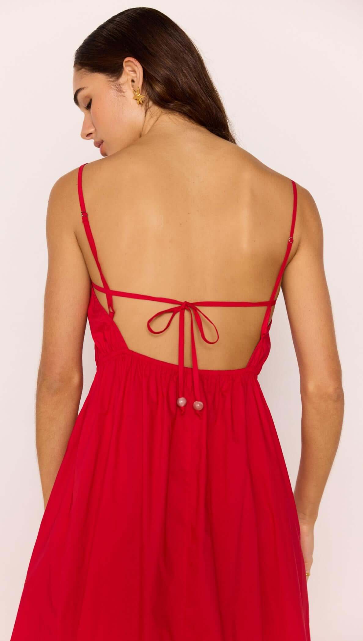Back view of the Red Cotton Linen Blend Tie-Back Maxi Dress showcasing tie-back detail and flowing skirt.