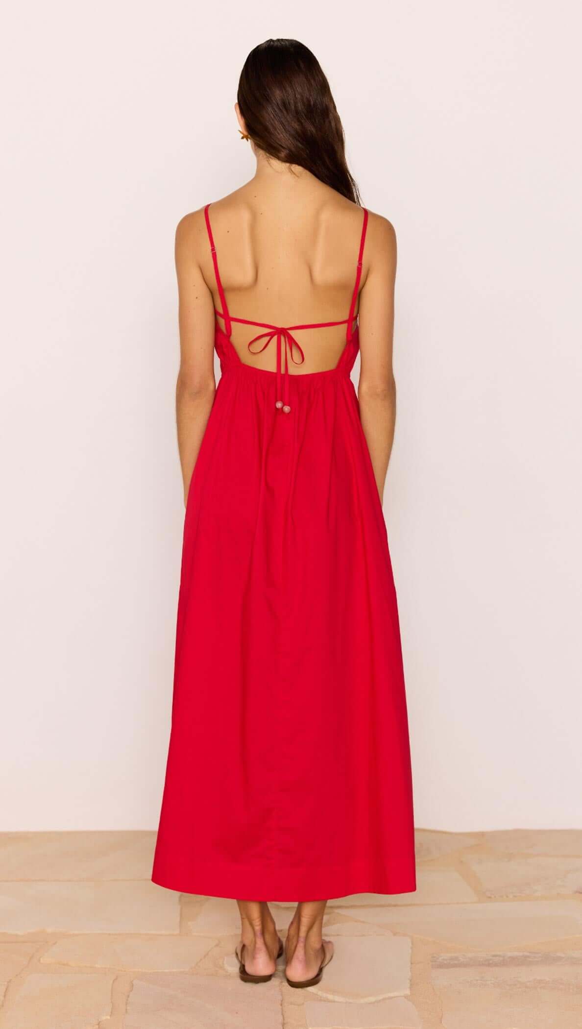 Back view of the Red Cotton Linen Blend Tie-Back Maxi Dress showcasing the adjustable tie and flowing skirt.