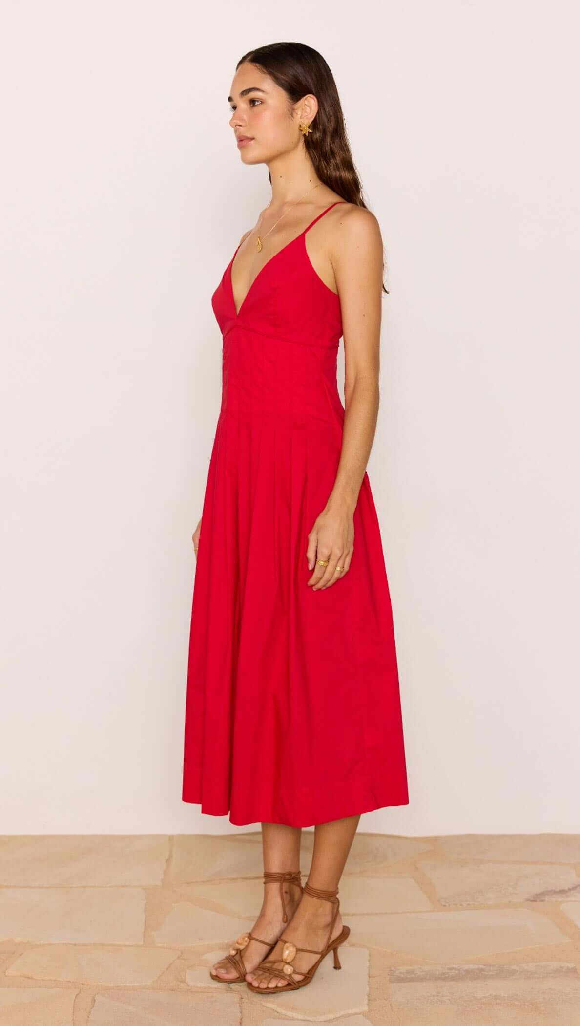 Red Cotton Linen Blend V-Neck Midi Dress displayed on a model, showcasing its elegant A-line silhouette and plunging neckline.