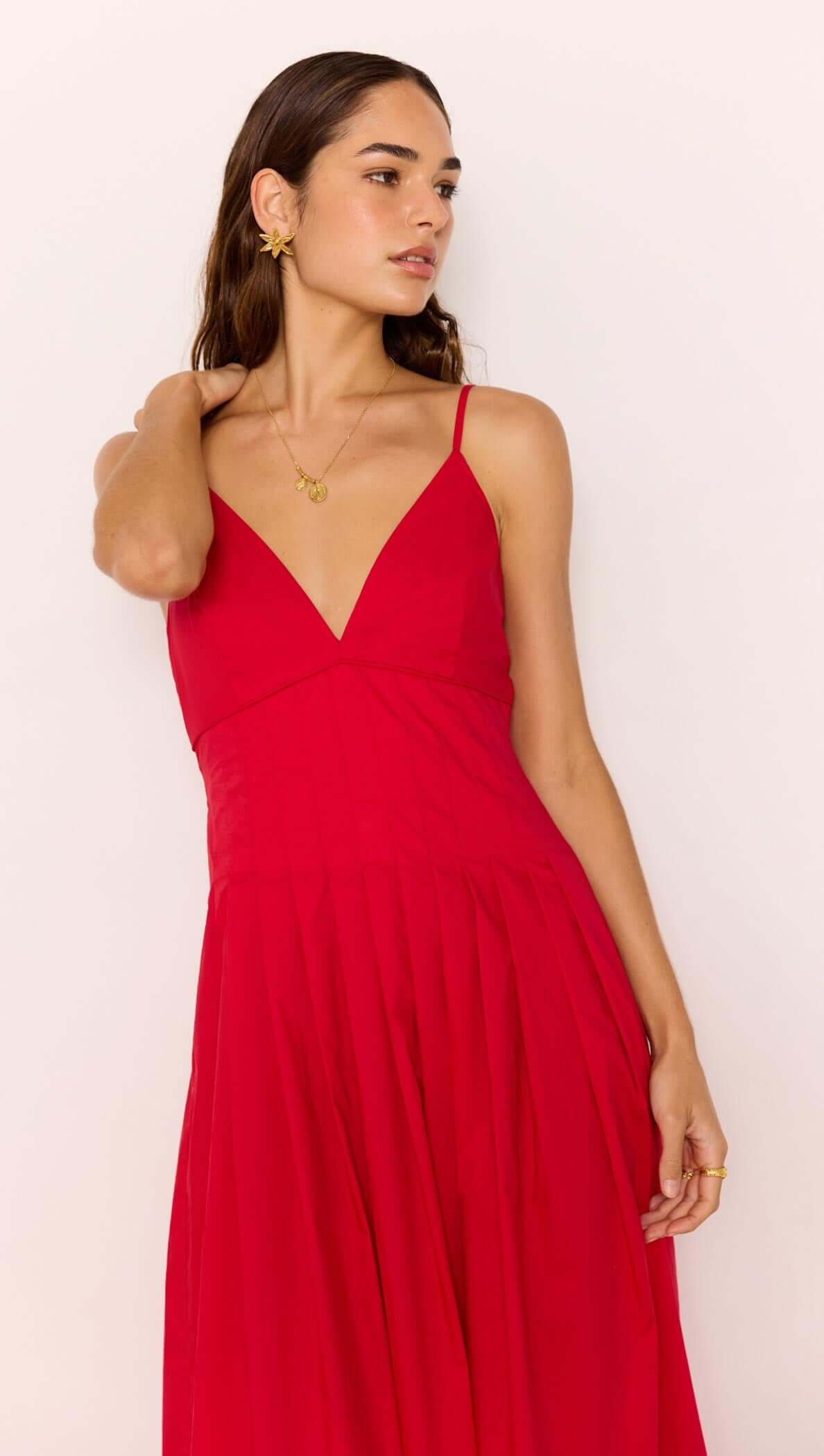 Model wearing a Red Cotton Linen Blend V-Neck Midi Dress, showcasing the elegant plunging neckline and flowing skirt.