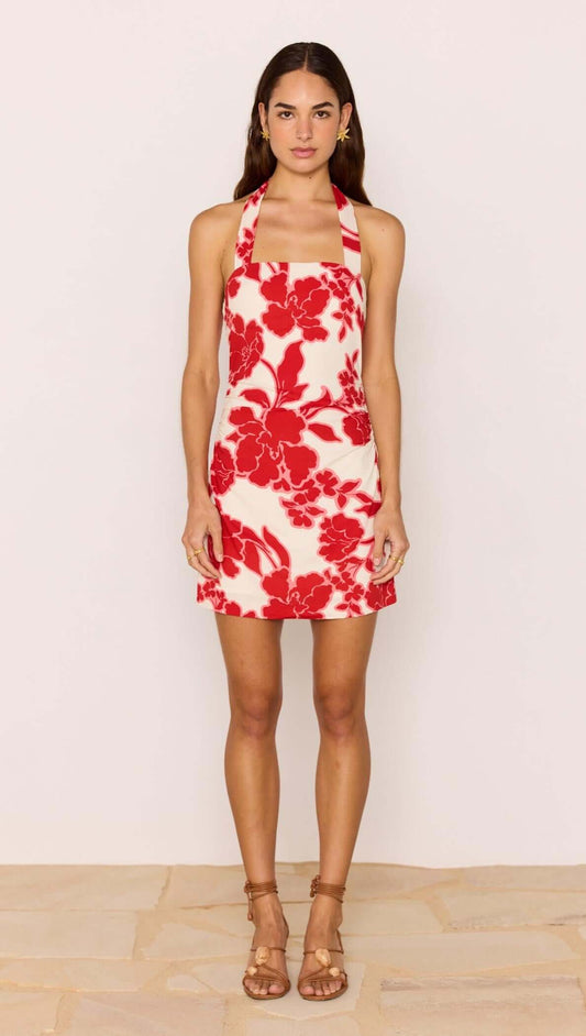 Red & White Floral Linen Blend Halter-Neck Mini Dress modeled by a woman, showcasing a bold floral print on a summer dress.