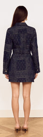 Model wearing a Paisley Jacquard Denim Shirt Dress, showcasing its back design and elegant silhouette.