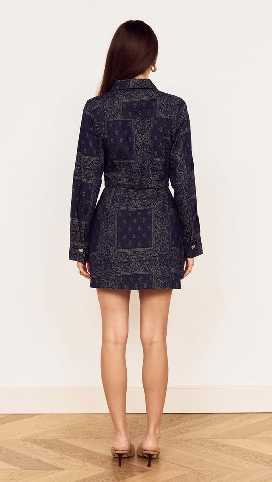 Model wearing a Paisley Jacquard Denim Shirt Dress, showcasing its back design and elegant silhouette.