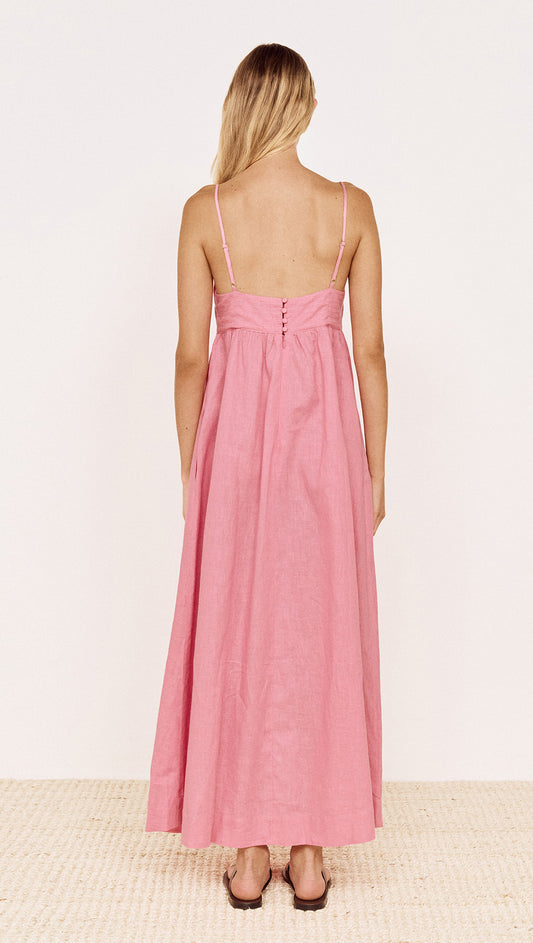 Back view of the Rose Linen Blend Maxi Dress with Bead Detail in a pink colorway, showcasing adjustable straps and flowing skirt.