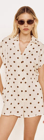 Relaxed Fit Playsuit in Chocolate Spot featuring a classic chocolate spot print on a soft cream base.