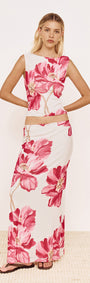Model wearing a Pink Floral Mesh Top with Low Back paired with a matching skirt, showcasing a vibrant floral design.