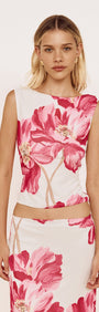 Pink Floral Mesh Top with Low Back worn by a model, showcasing bold pink floral print and fitted silhouette.