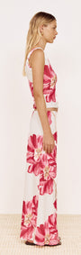 Model wearing Pink Floral Mesh Top with Low Back paired with coordinating floral skirt, showcasing side view.