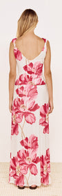 Woman wearing a Pink Floral Mesh Maxi Skirt, showcasing the back view with a bold floral print.