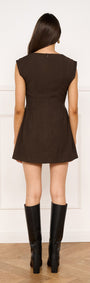 Pleat Waisted Mini Dress in Chocolate worn from the back, showcasing a fitted silhouette and gathered skirt.