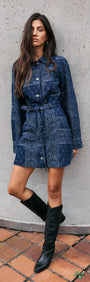 Model wearing a Paisley Jacquard Denim Shirt Dress with a collared neckline and waist tie, styled with knee-high boots.