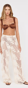 Model wearing Embroidered Net Relaxed Beach Pant with floral embroidery and wide-leg silhouette.
