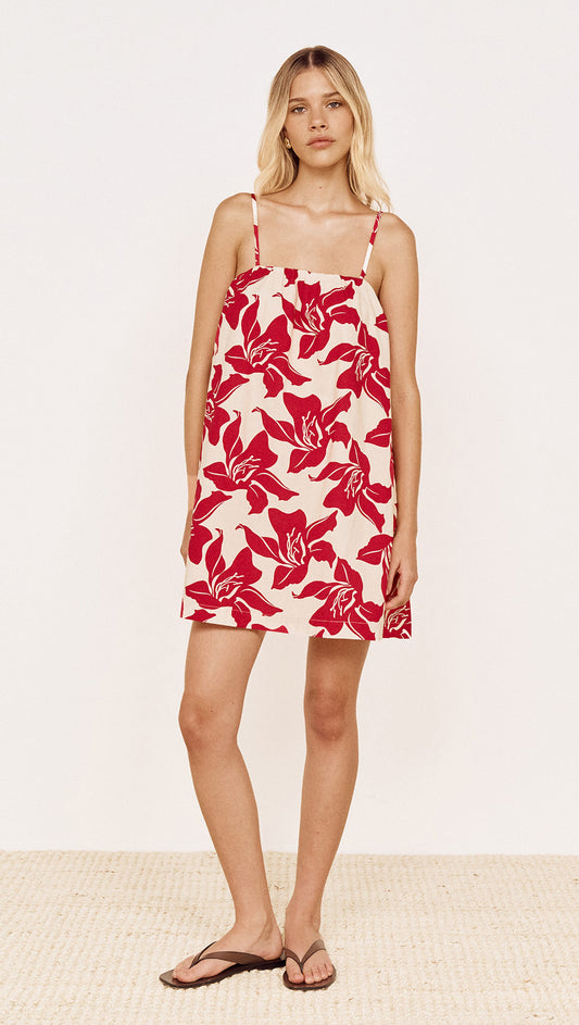 Cotton A-Line Mini Dress in Red Floral worn by a model, showcasing a bold red floral print and relaxed silhouette.