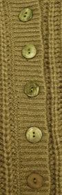 Close-up of buttons on the Green Cable Knit Cropped Cardigan showcasing its earthy olive hue and chunky knit texture.