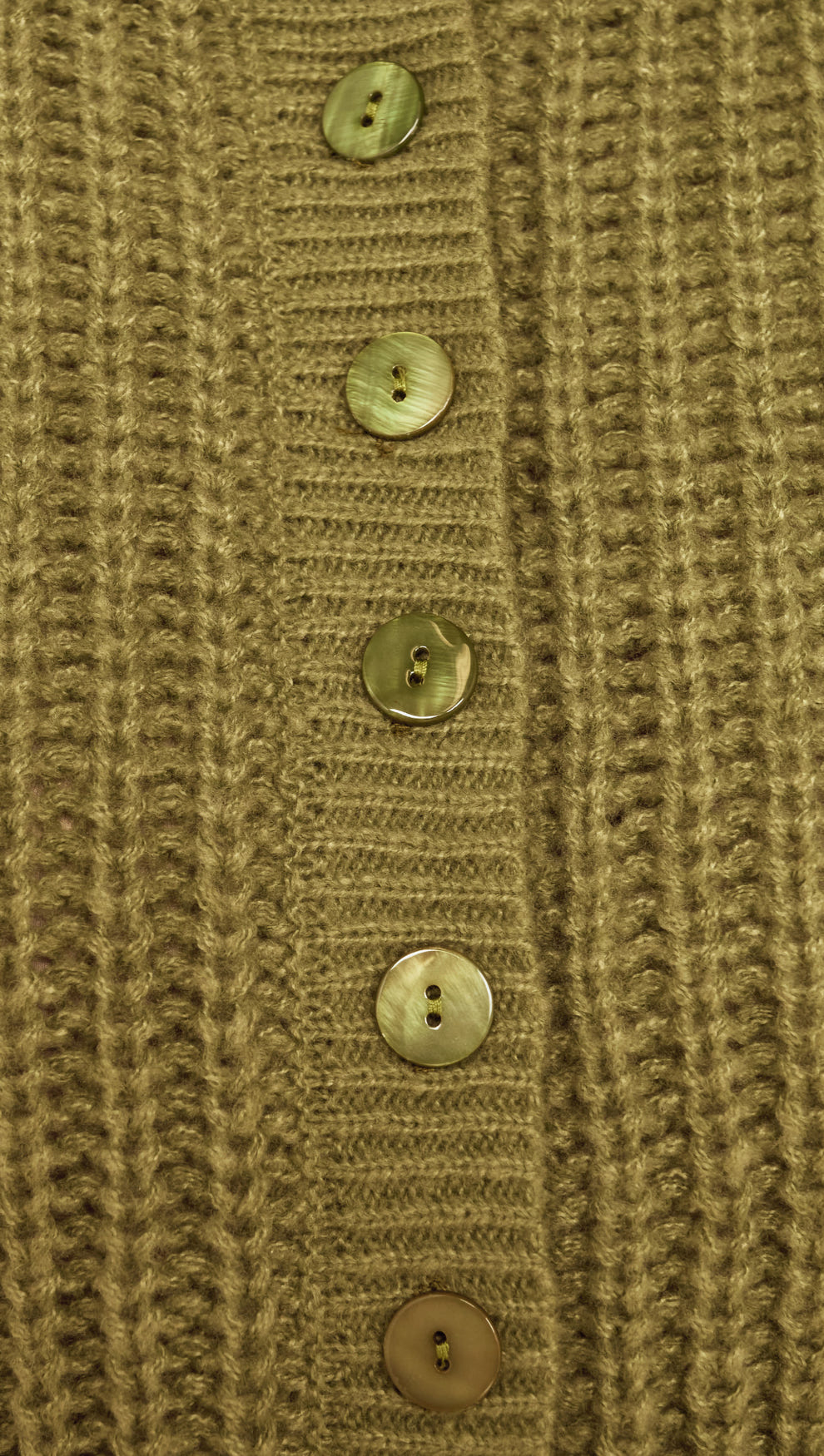 Close-up of buttons on the Green Cable Knit Cropped Cardigan showcasing its earthy olive hue and chunky knit texture.