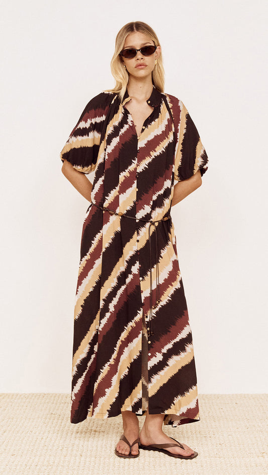 Puff Sleeve Belted Shirt Dress in Abstract Stripe worn by a model, featuring diagonal stripe print in chocolate, burgundy and neutrals.