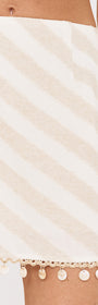 Cotton Linen Blend Mini Skirt with Shell Detail featuring a diagonal stripe design and decorative tassel trim.