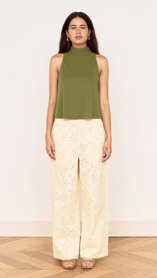 Model wearing a Green High Neck Jersey Top paired with light-colored wide-leg pants.