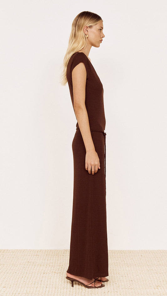 Side view of a model wearing a Cap Sleeve Mesh Maxi Dress in Chocolate with a scoop neckline and cap sleeves.