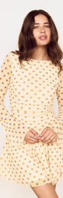 Butter Yellow Polka Dot Mini Dress with Drop Waist, showcasing a playful design and flattering silhouette.