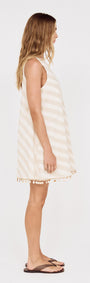 Cotton Linen Blend Mini Dress with Shell Detail shown on a model from the side, featuring a striped design and tassel hem.